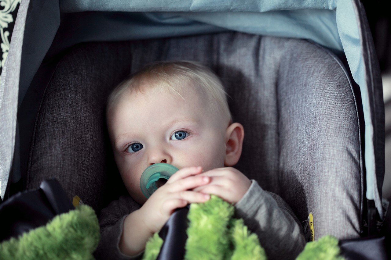 Child safely secured in car seat